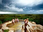 Peninsula Hot Springs hill top pool storm